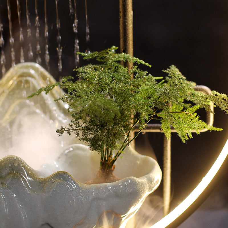 AquaLuxe indoor fountain with LED ring and fog effect