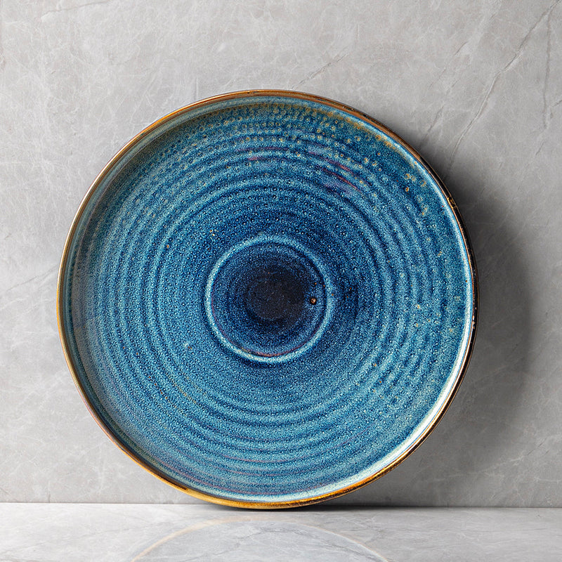 Assiette plate bleue du set de vaisselle Mykonos